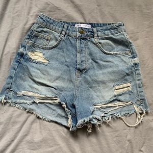 High waisted distressed medium wash jean short. Size 8. From Zara.